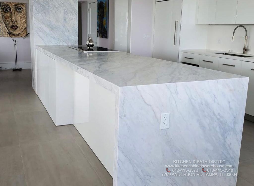 White Glossy Kitchen Cabinets &  Carrara Marble Countertop