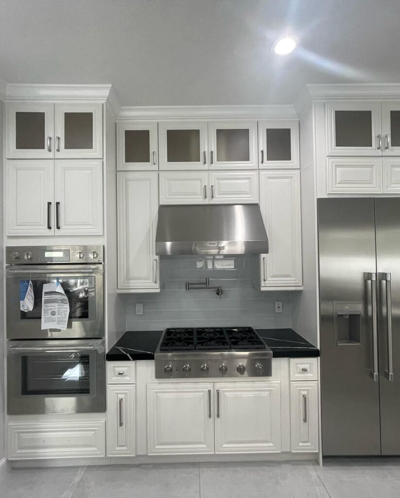 White Shaker Kitchen Cabinets and Black Marquina Quartz Countertop