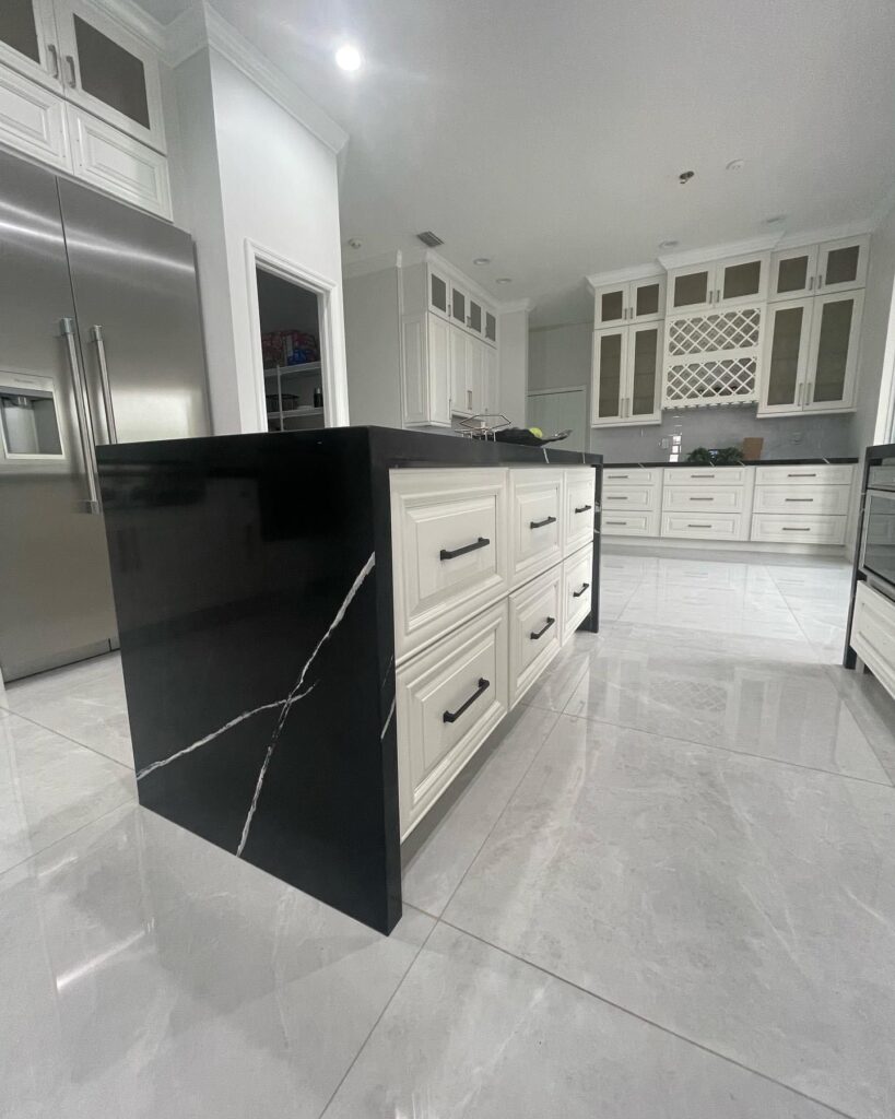 White Shaker Kitchen Cabinets and Black Marquina Quartz Countertop